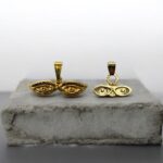Gold-Tone Double Eye Pendant